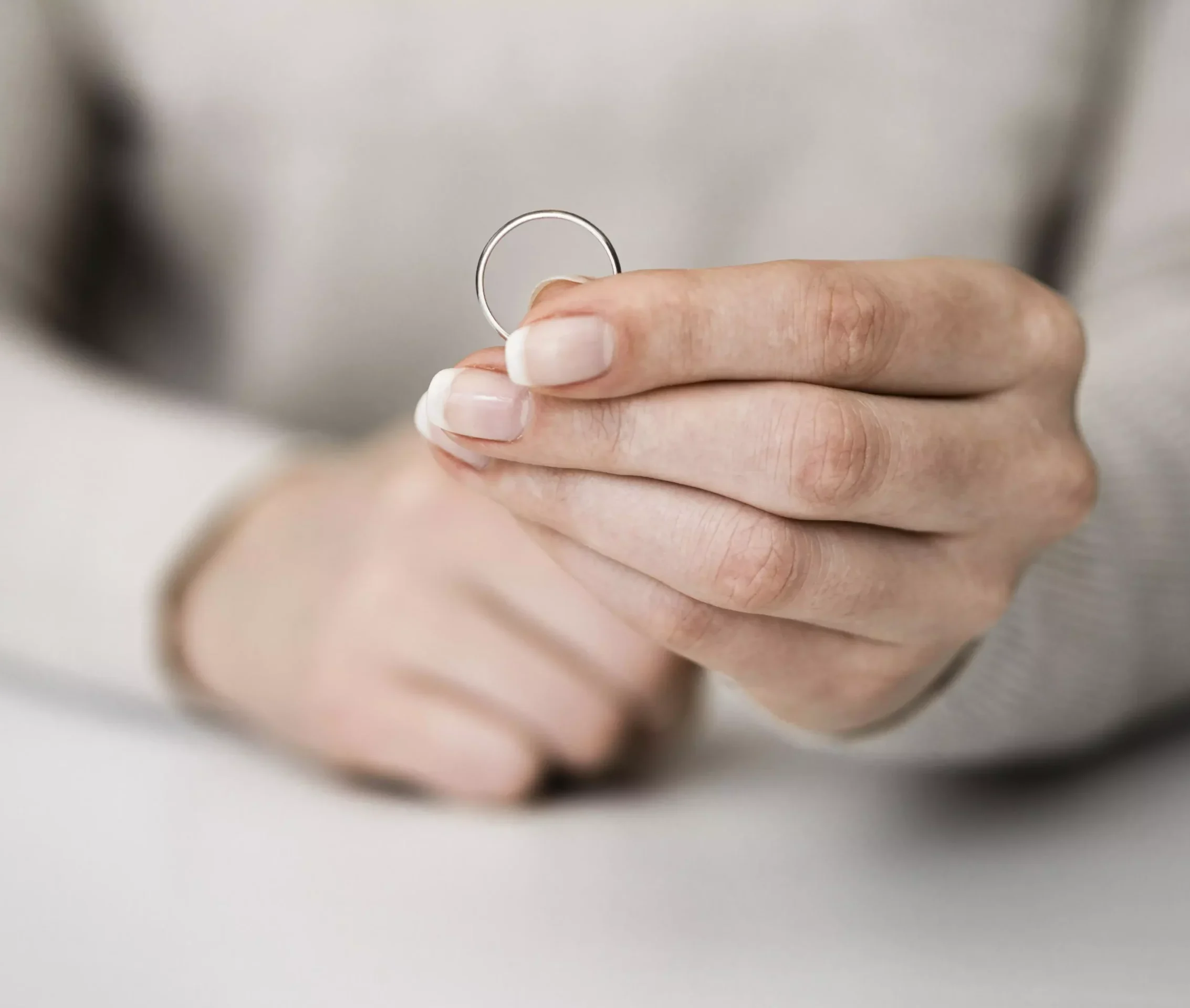 woman-holding-marriage-ring (1)